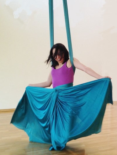 aerial silks student swinging